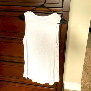 Sleeveless white tank, flowy fit